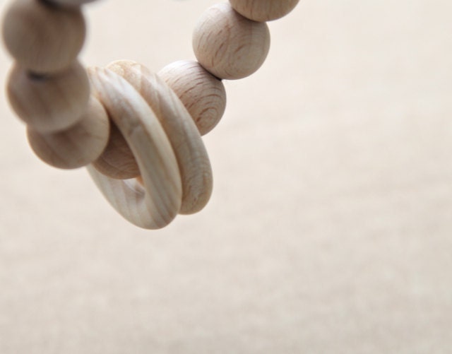 Teething ring toy with wooden beads and 2 wooden rings. Neutral waldorf wooden beads rattle.