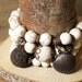 Natural white Magnesite 7"-9" eleastic bracelet, with a valcano rock. shell locket . 3 in one set.