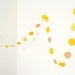 Yellow garland with paper flowers