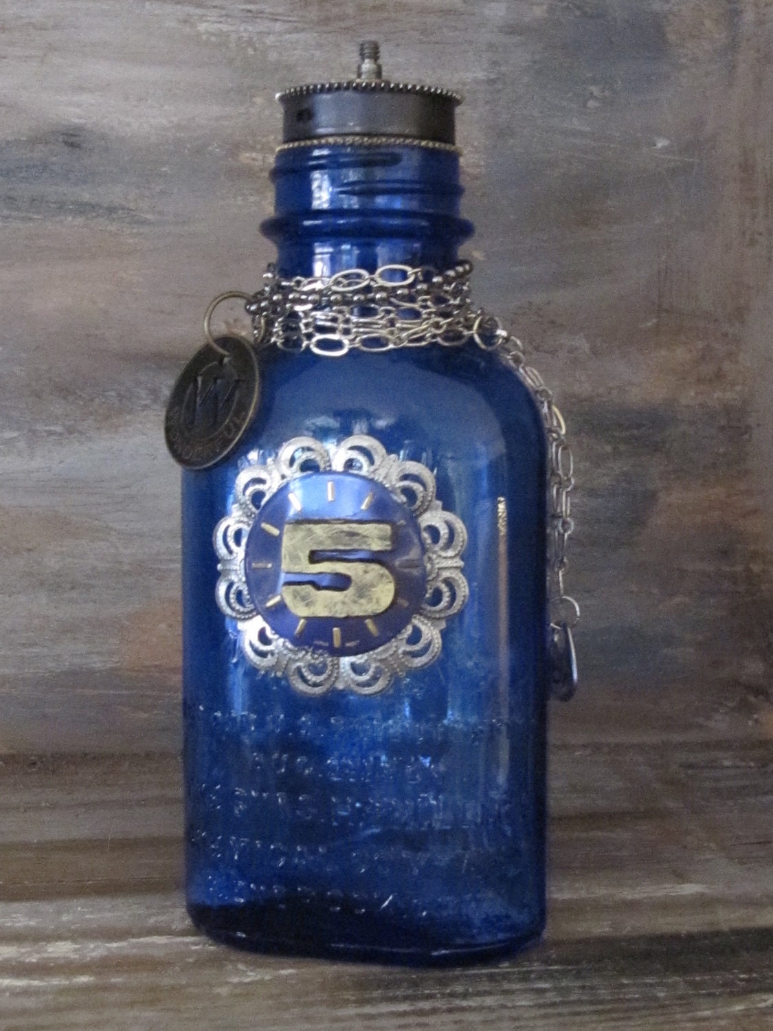 Cobalt blue medicine bottle, a steampunk theme with vintage items