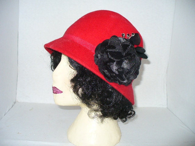 Womens Red Cloche felt hat Black silk flower rhinestones and feathers.