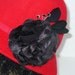 Womens Red Cloche felt hat Black silk flower rhinestones and feathers.