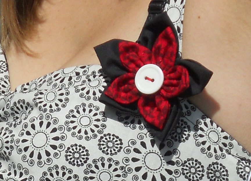 rockabilly halter top in black an white swirls with flower pin.