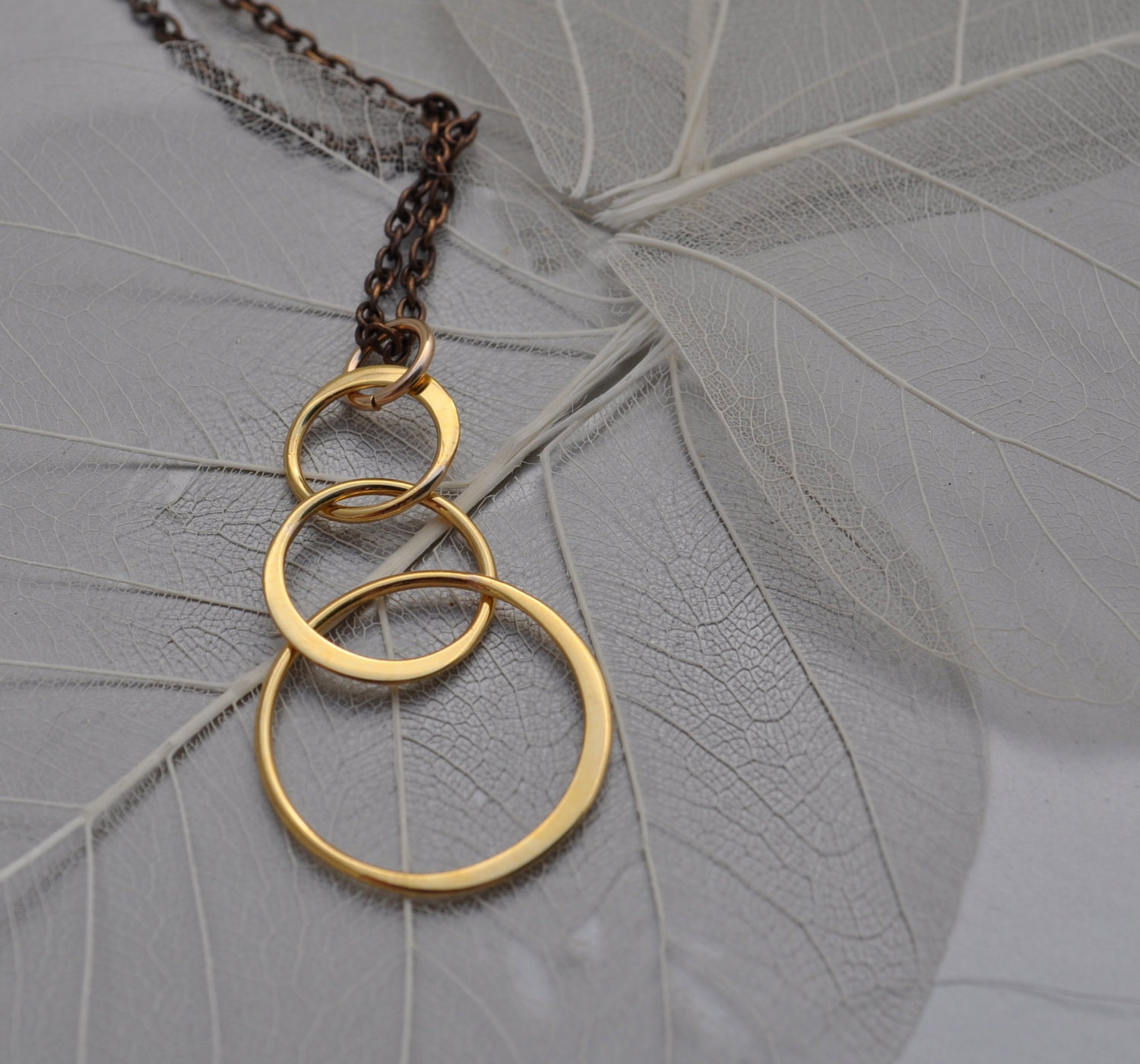 infinity three circle bronze necklace