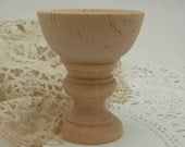 wooden ring cup on pedestal