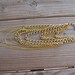 Gold mutli chain arm chain