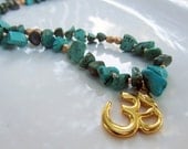 Gold plated Om pendant on turquoise howlite beaded boho yoga necklace