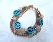 multi strand boho chic rose quartz, tourmaline, and turquoise peace sign beaded bracelet
