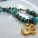 Gold plated Om pendant on turquoise howlite beaded boho yoga necklace