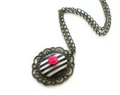 Antique bronze cameo with black and white  polymer clay  stripes and fuchsia rose