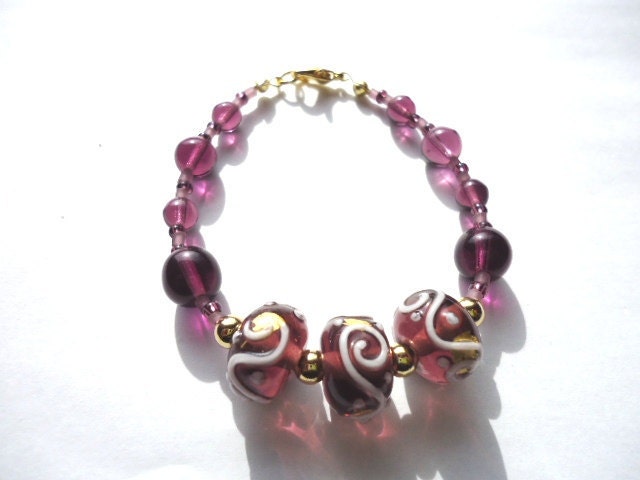 Bracelet Handmade Purple Glass Lampwork Bead with White Spirals by JulieDeeleyJewellery on Etsy