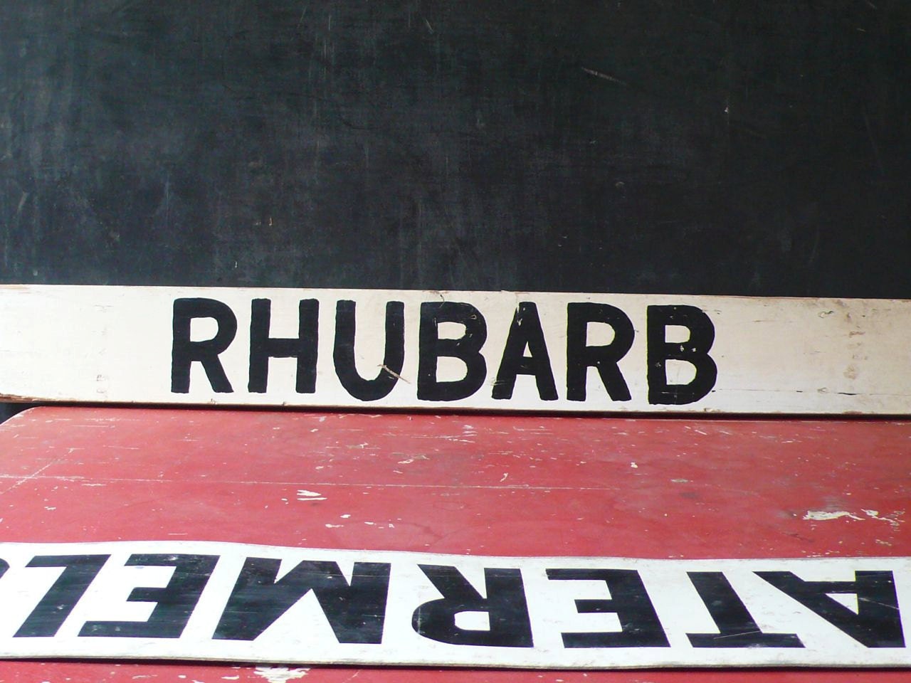 Vintage Wood Road side produce sign. Rhubarb