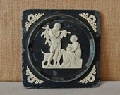 antique metal wall tile or plaque of Greek god or Roman god