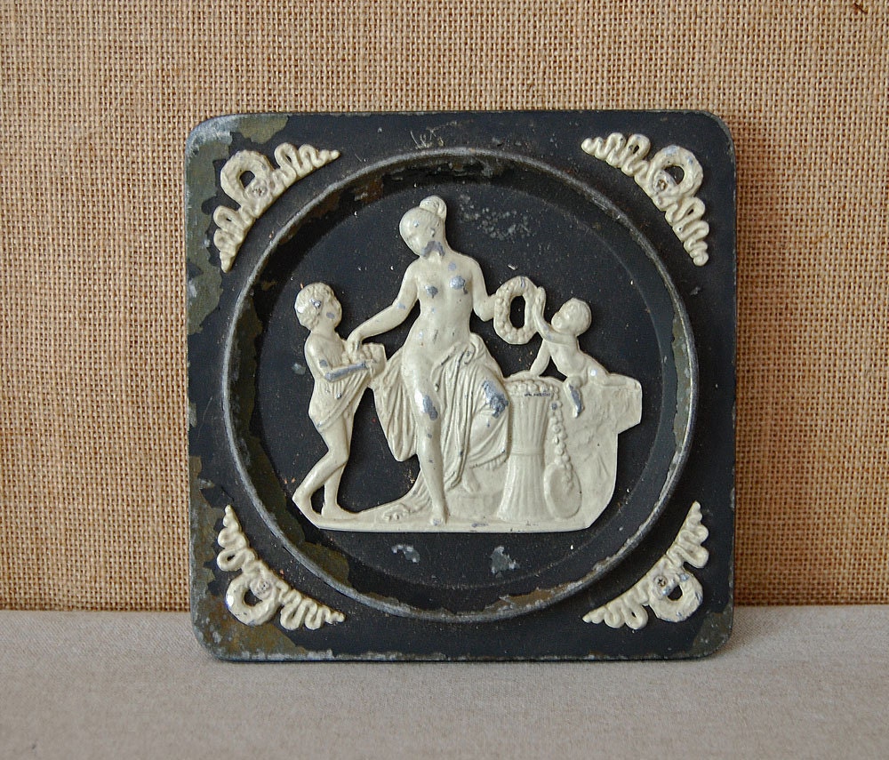 antique metal wall tile or plaque of Greek goddess or Roman goddess