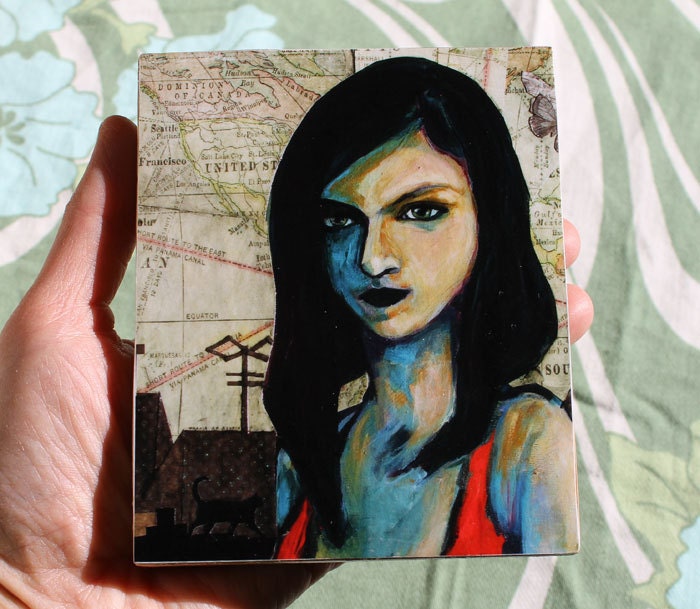 Cityscape at night with woman and black cat- print mounted on wood