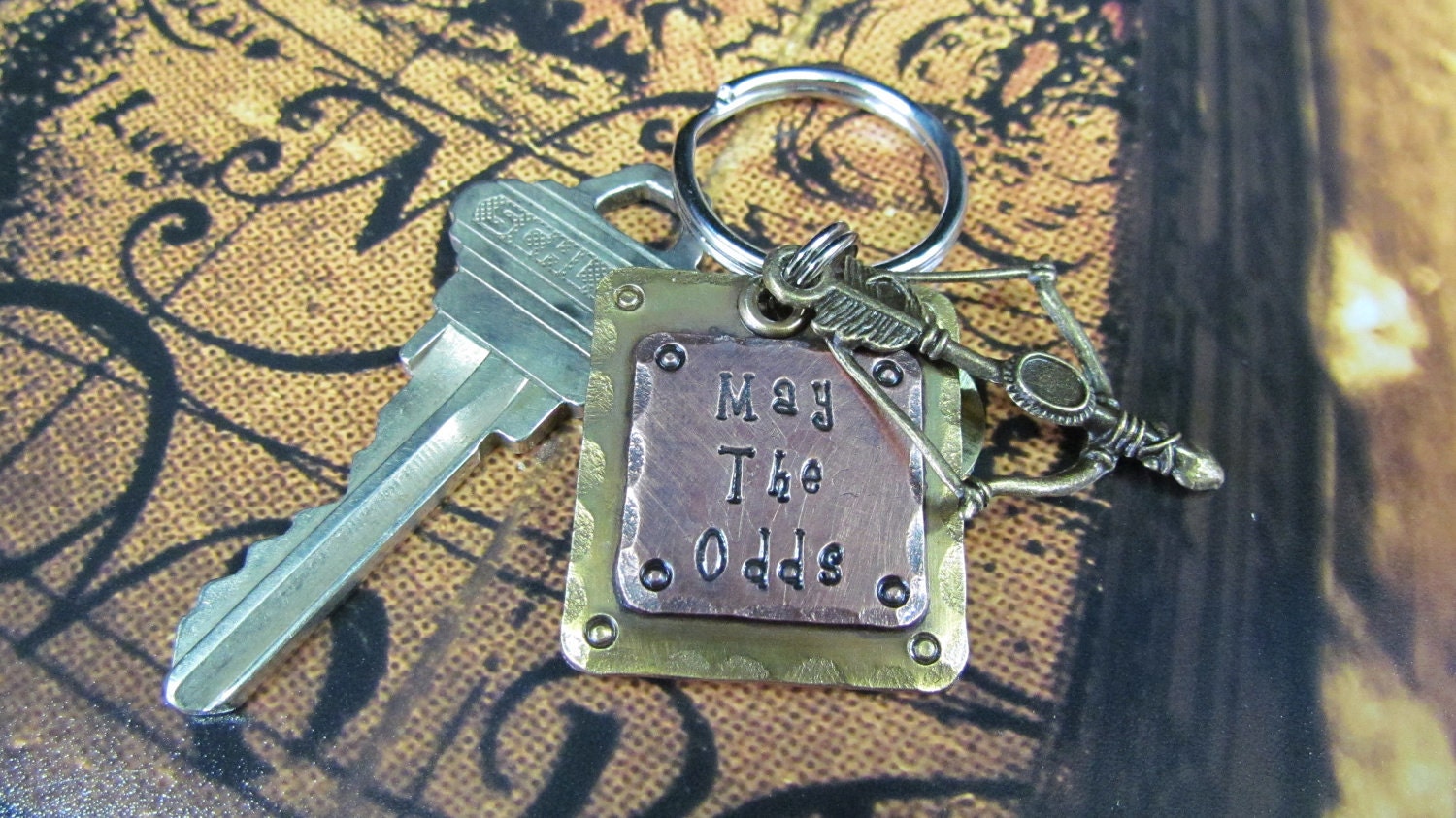 Hunger Games Inspired "May The Odds"......  Keychain
