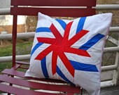 red and blue starburst pillow