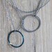 Two circles necklace: oxidized sterling silver and blue copper circles - modern jewelry