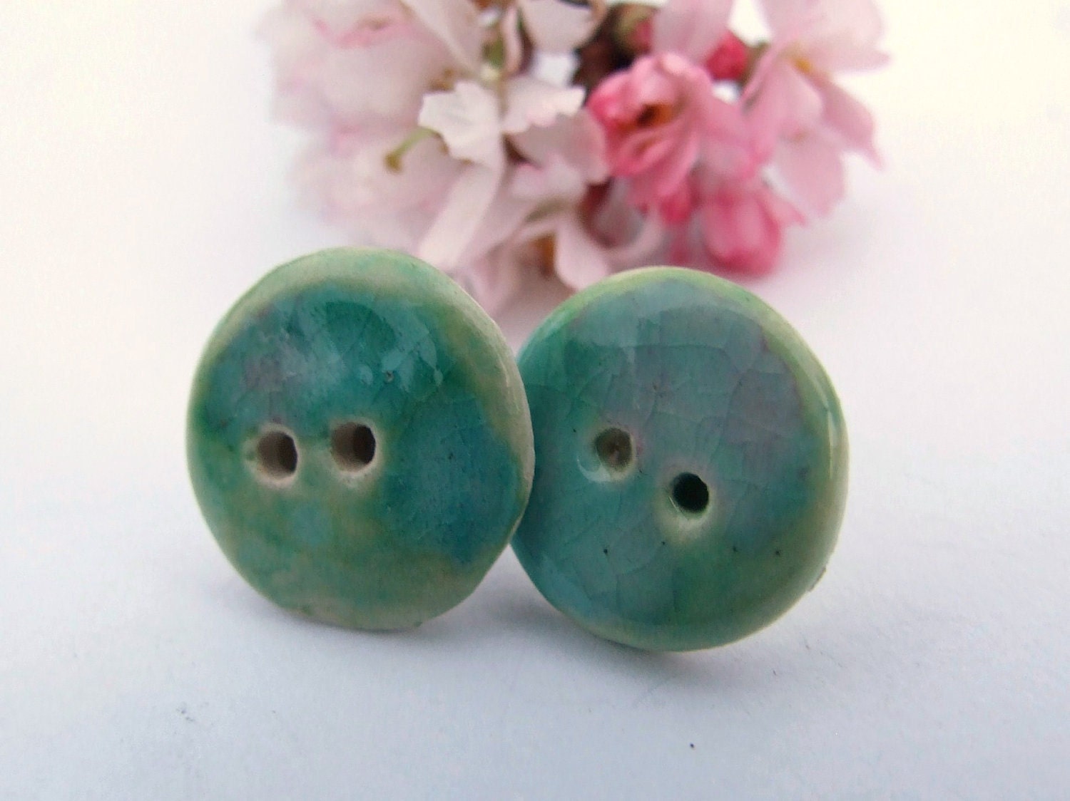 Ceramic button earrings, spring green blushed with pink crackle glaze on silver plated studs