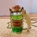 Harry potter and Game of Thrones inspired Dragon blood in a glass far with Dragon tooth fang charm necklace