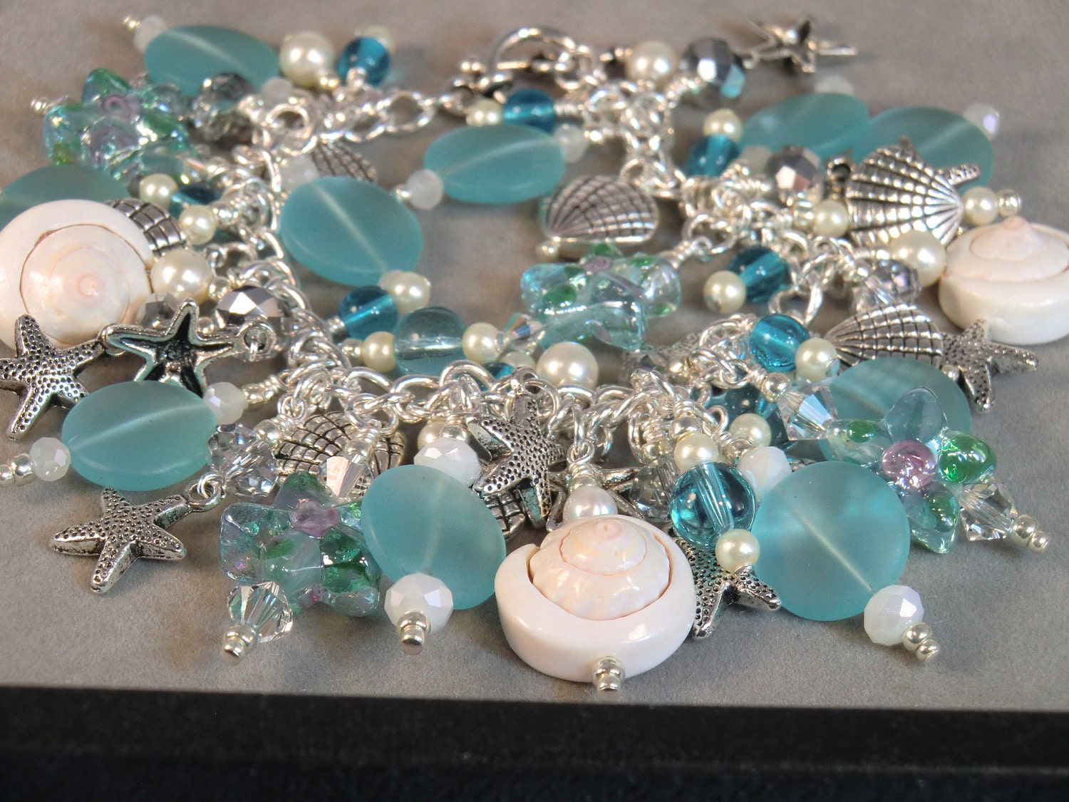 Aqua starfish, seaglass, and shell beach cha cha bracelet, cream and turquoise ocean charm bracelet with shells and starfish