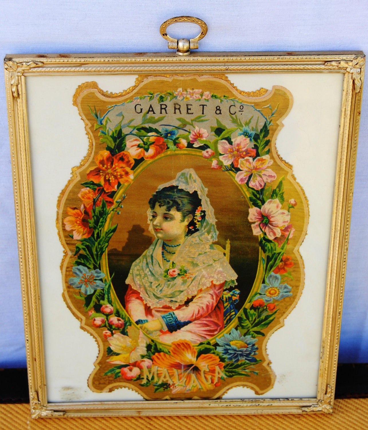 Framed vintage label from Spanish olive company
