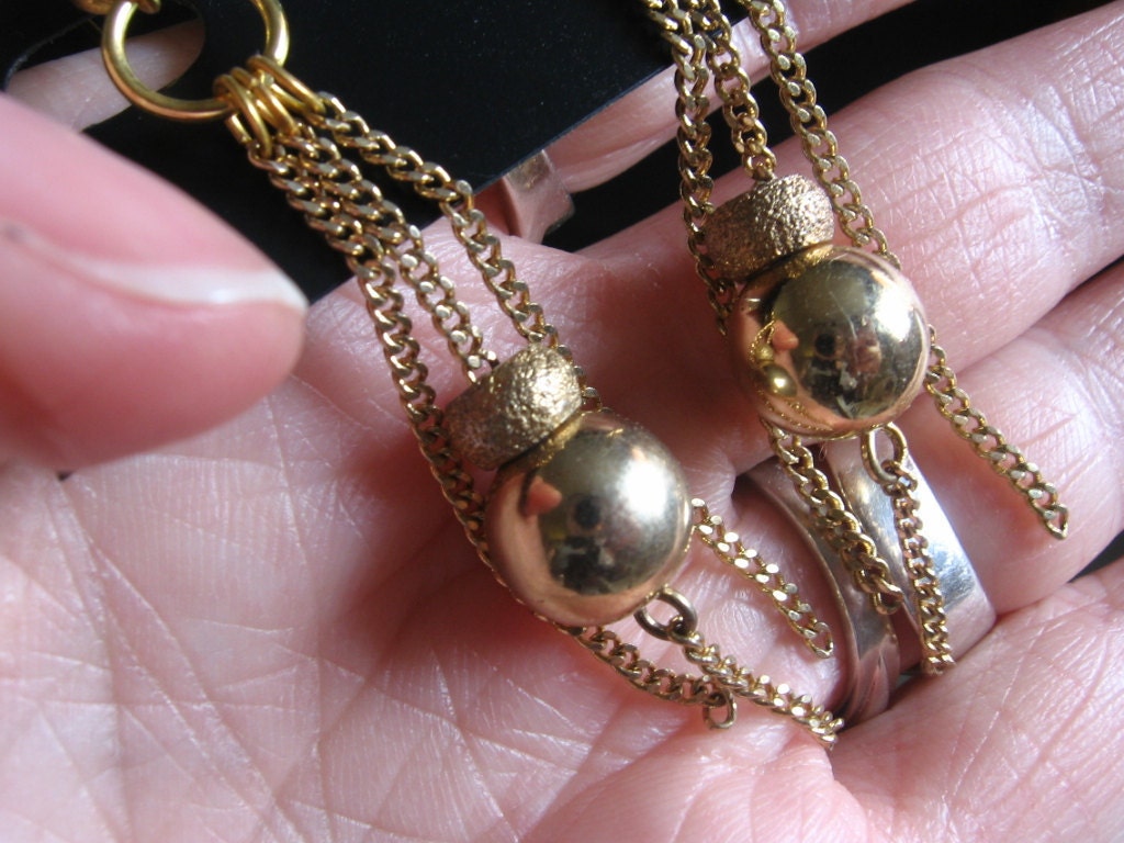 Golden ball & Chain Earrings.  Christmasy earrings with Yellow Gold vogue Chains and Gold Balls. Gold plated Ear wires.