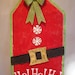Santa gift tag hand painted burlap door/wall hanging in christmas red and embellished with burlap belt, candy buttons and glitter bow