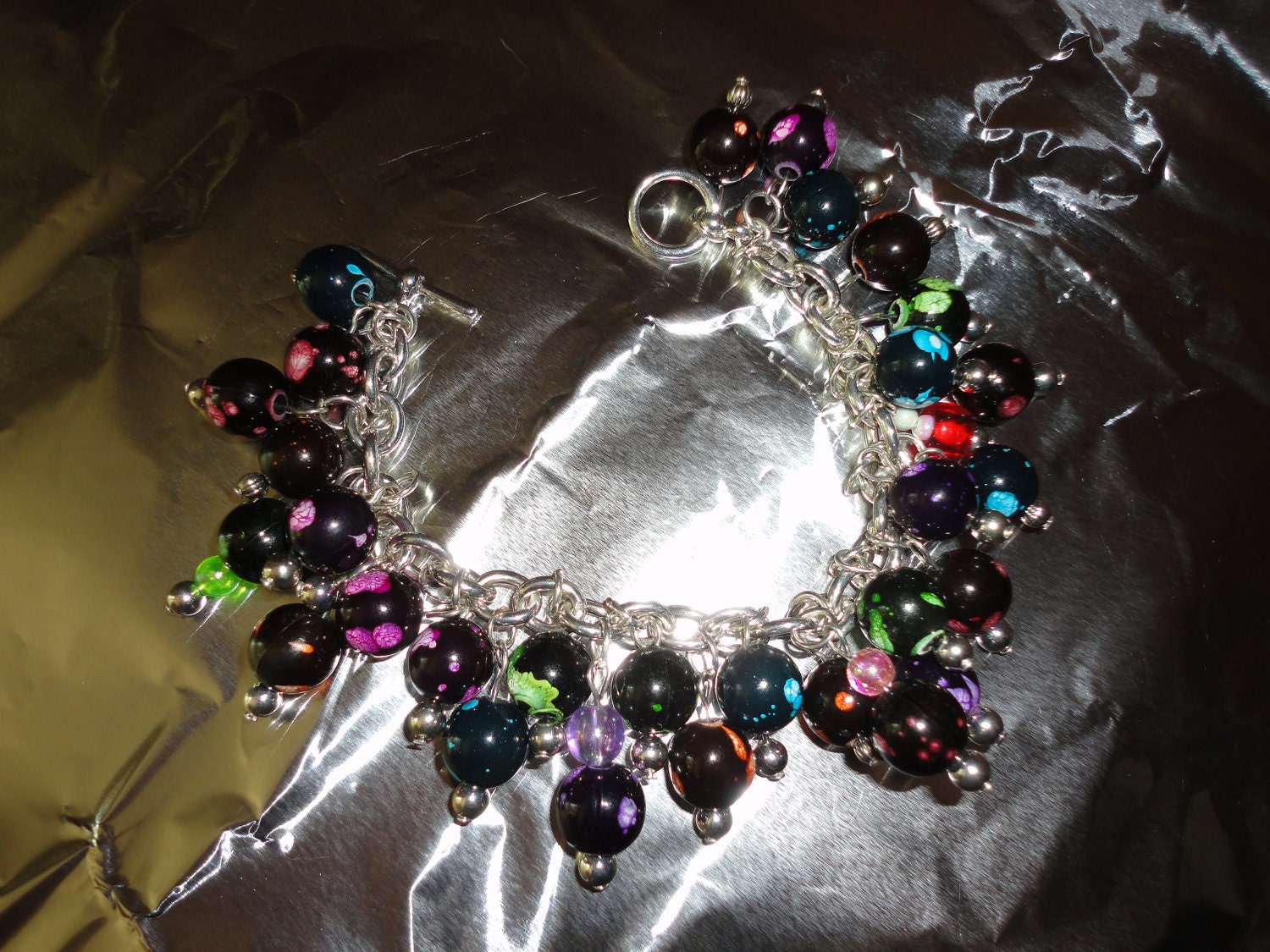 Black Beads of Many Colors on Chain Bracelet