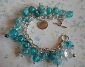 Turquoise color beads on silver chain bracelet