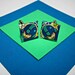 Mega Man Cufflinks. Video Game Comic Capture. Upcycled Recycled Capcom Comic Collage. Android. Wood Base.