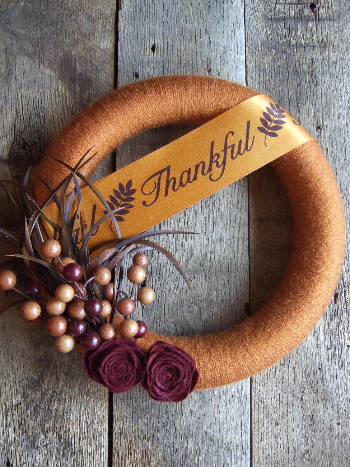 Fall Yarn Wreath with felt flowers berries and feathers