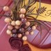 Fall Yarn Wreath with felt flowers berries and feathers
