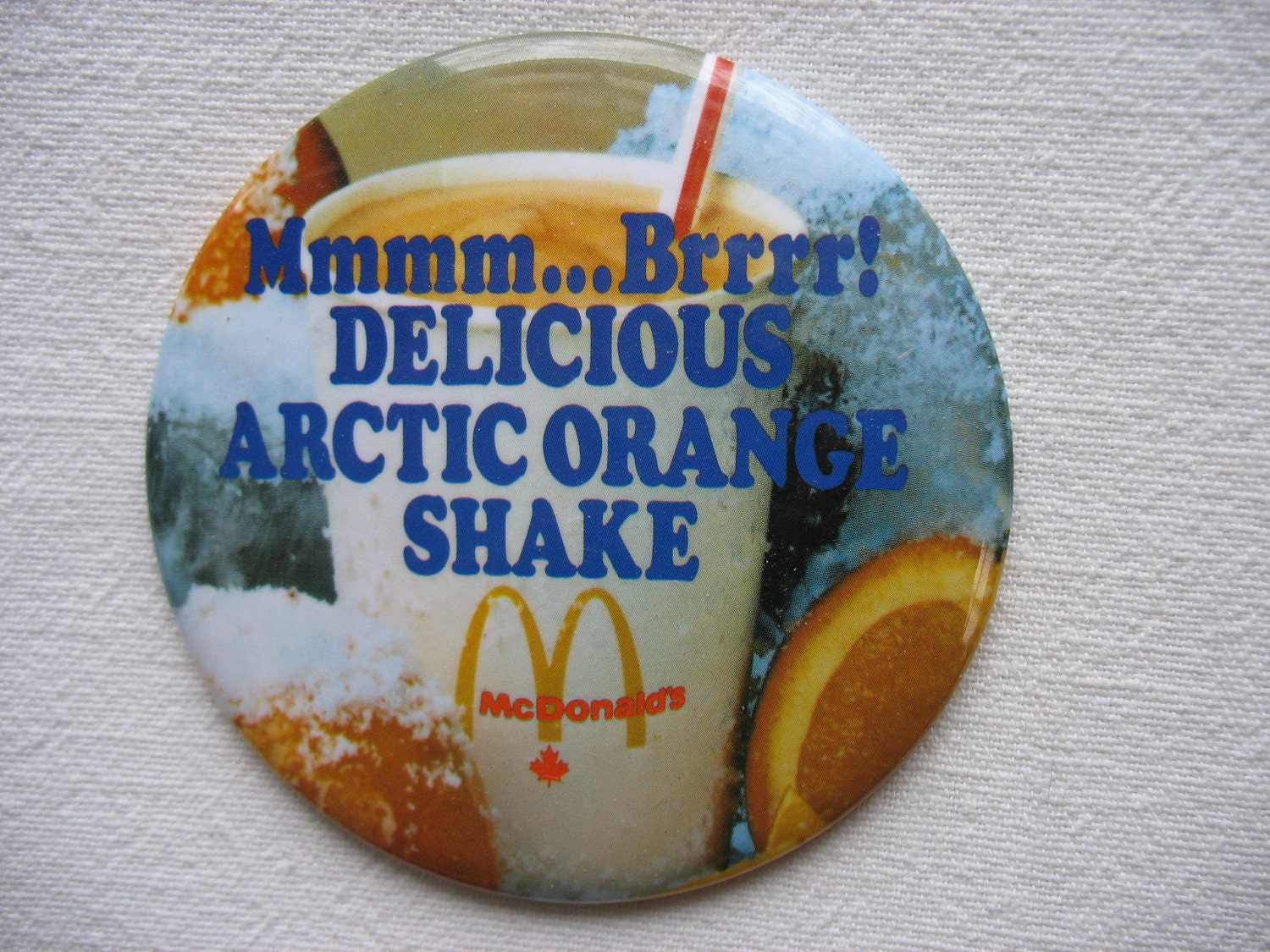 McDonald's Canada Pin Back Button Badge Delicious Arctic Orange Shake Mmmm...Brrrr