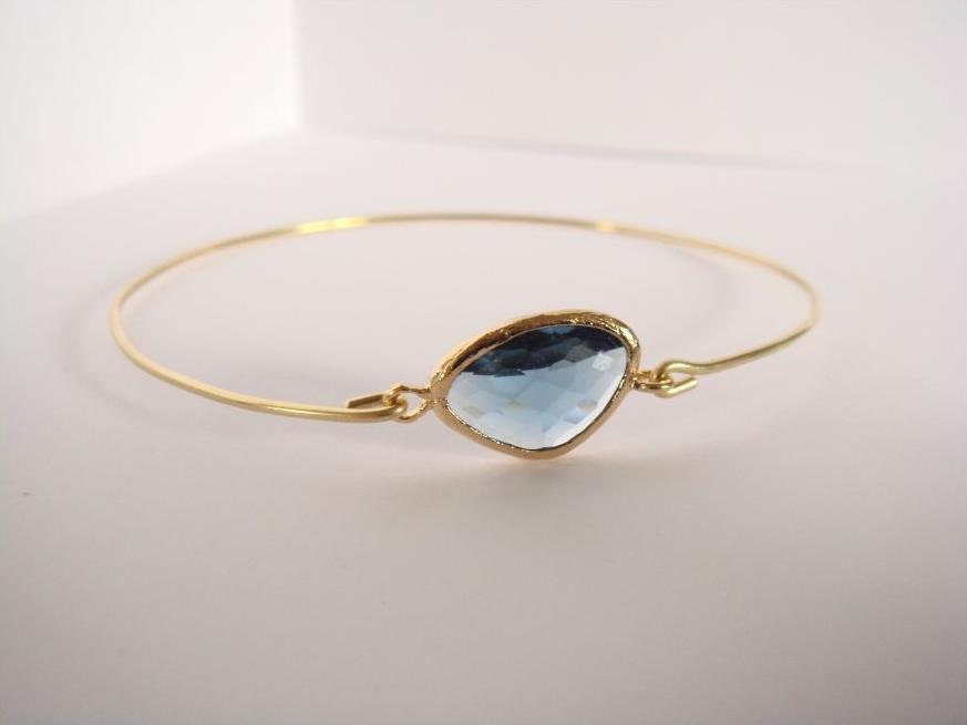 Blue montana faceted glass and gold bangle