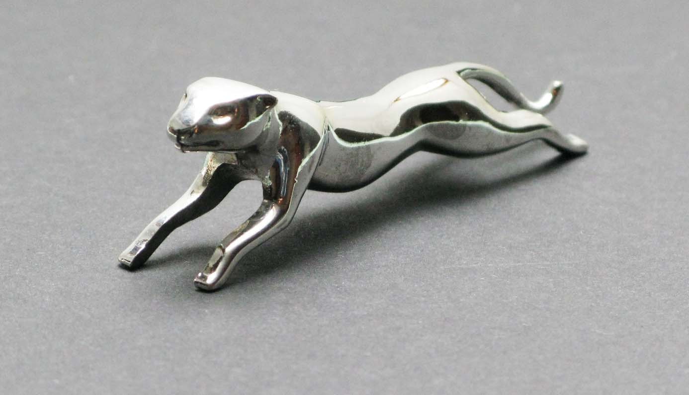 A set of 6 french silver plated panther knife rests