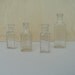 Lot of Four Vintage Clear Medicine Bottles