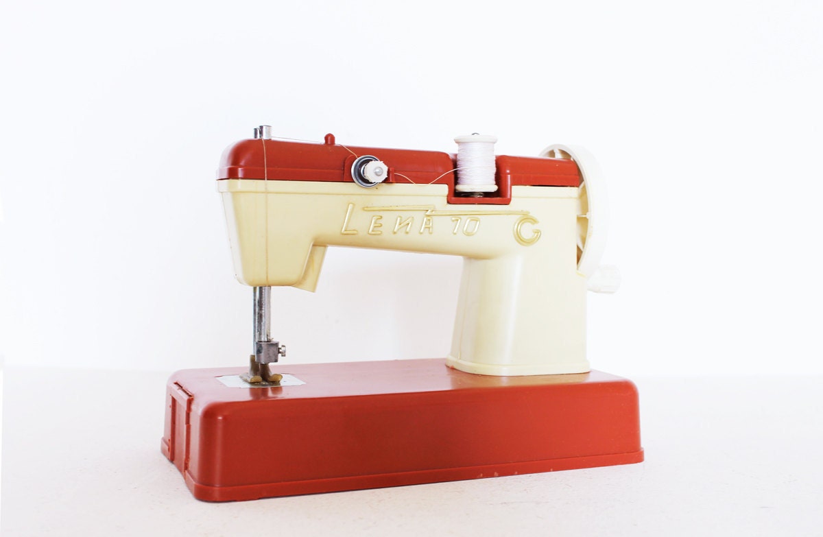 Vintage red and cream toy sewing machine
