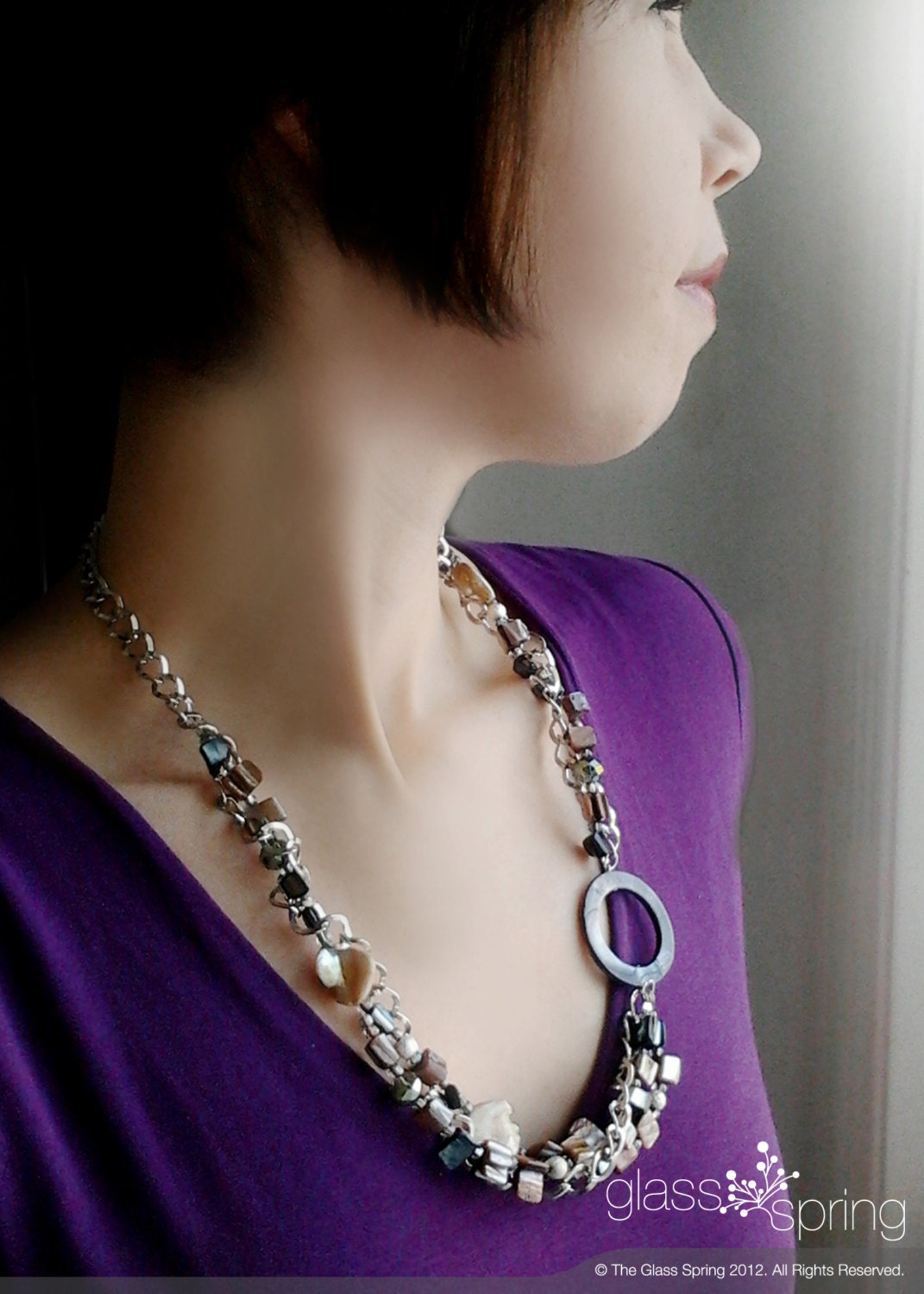 Long chunky beaded necklace with silver chain, with seashell and crystals and finished with a lobster clasp