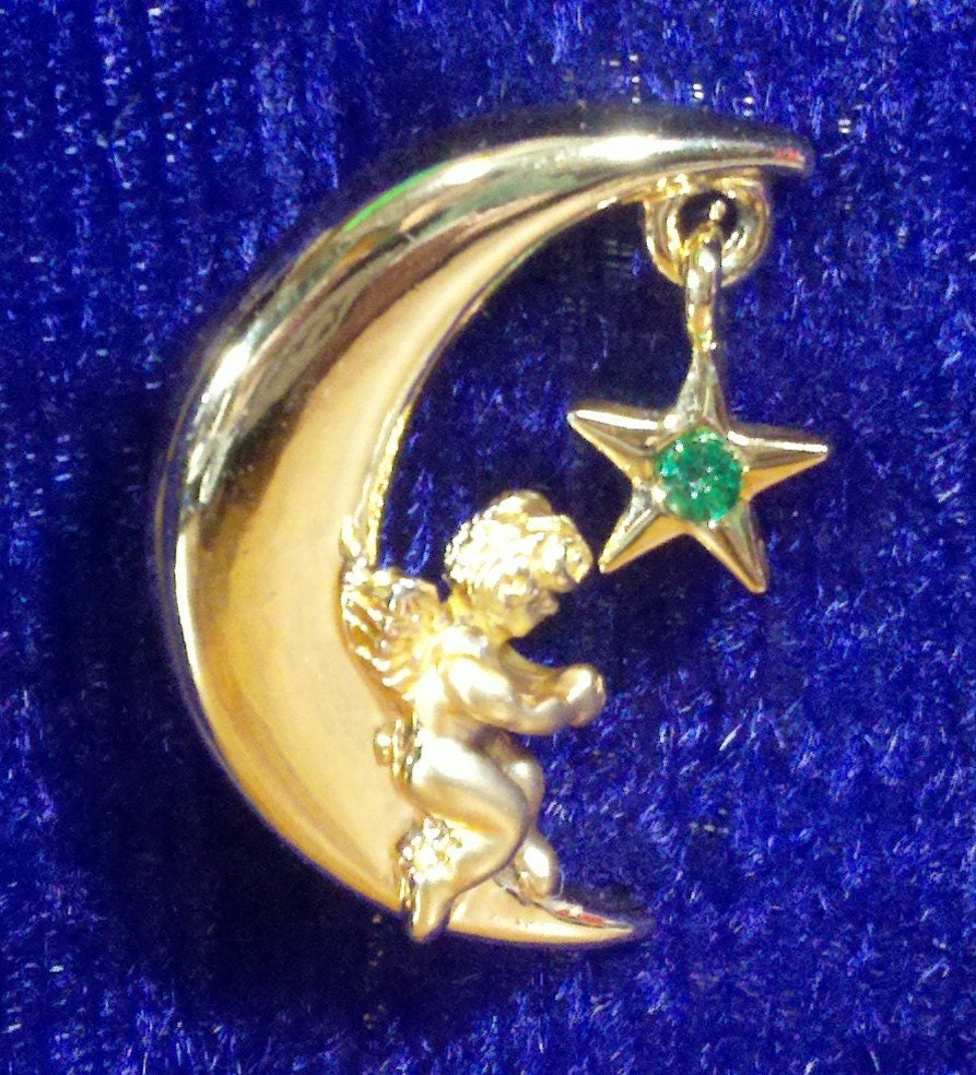 Razza signed brooch green rhinestone star hanging on moon with angel.