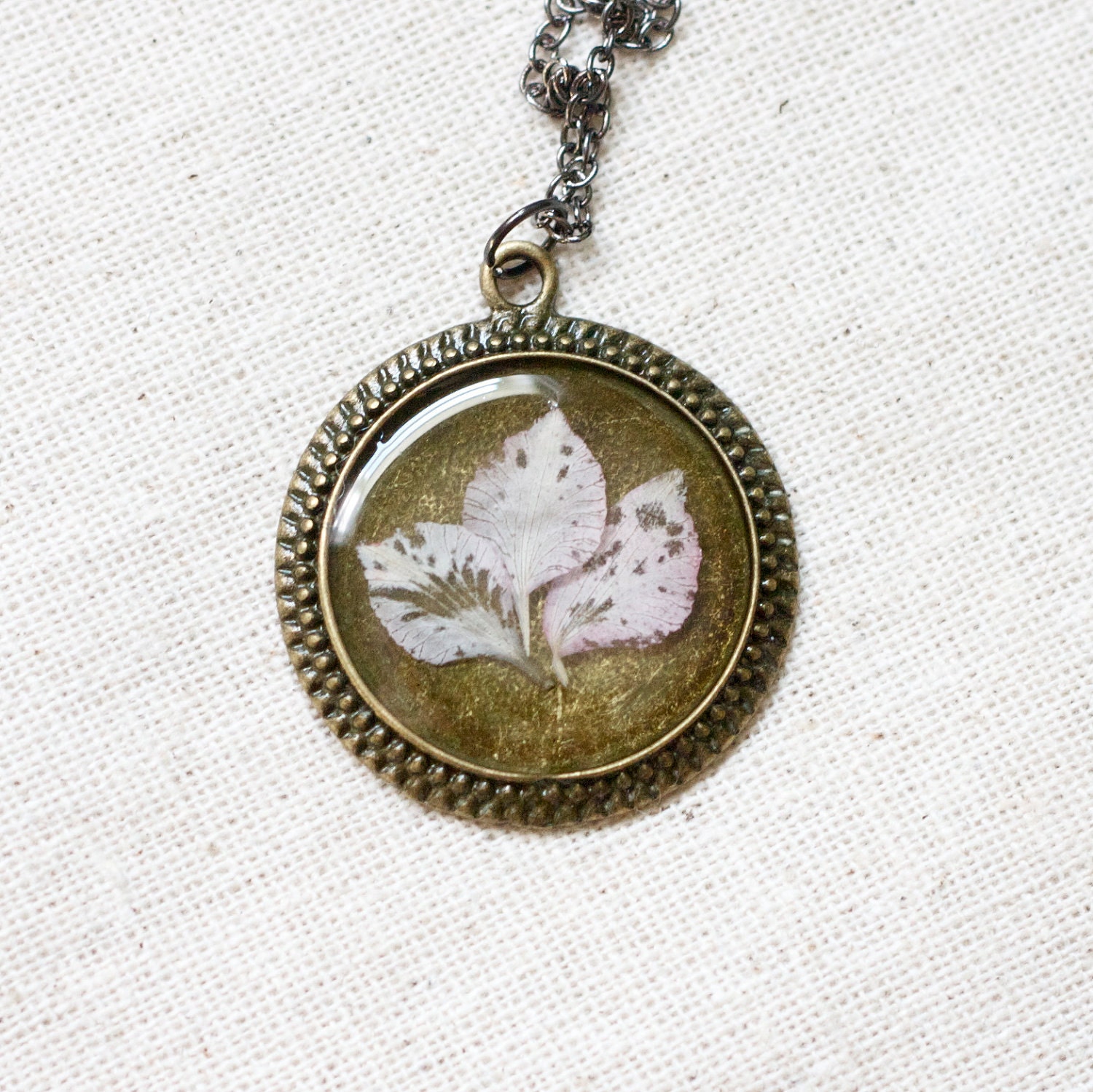 pressed flower necklace resin necklace soft pink delphinium petals set in resin. shabby chic circle filigree pendant for summer. prairie.