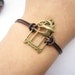 Bracelet---antique bronze birdcage and bird&brown leather chain