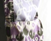 Purple Ikat messenger bag with contrasting lavender lattice lining. Roomy crossbody bag with flap closure.