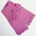 Lilac fingerless gloves.