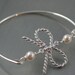 bow and pearls modern thin Bangle