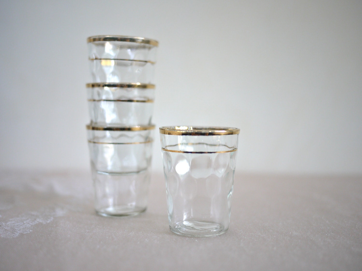 Items similar to Gold Rimmed Small Shot Glasses Set of Four on Etsy