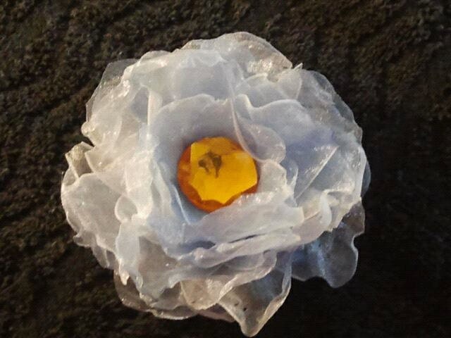Sheer Fabric Flower / Lighter shade of Blue Flower with a large yellow orange rhinestone hairclip