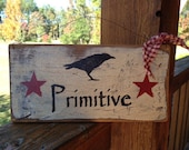 PRIMITIVES Primitive sign with Crow and Barn Red Stars