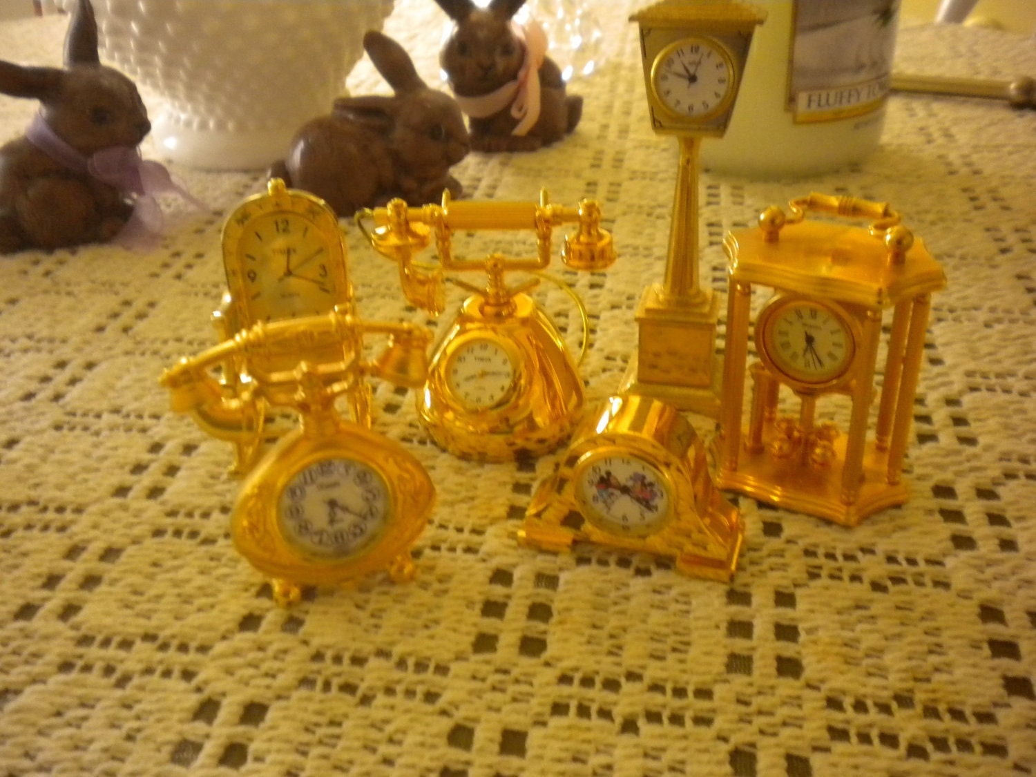 SALE....Collection of small metal and glass clocks,cottage,collectables,telephone,rocking chair,lamp post,Mickey and Minnie Mouse