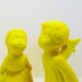 kissing angel statues // ceramic figurine set // fluorescent neon yellow // upcycled home decor